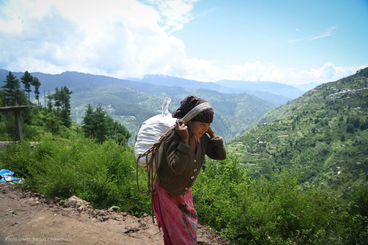 Vimla Devi carrying the relief materials provided by CASA